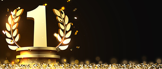 Auf dem Bild ist eine goldene 1 mit Ehrenkranz zu sehen.